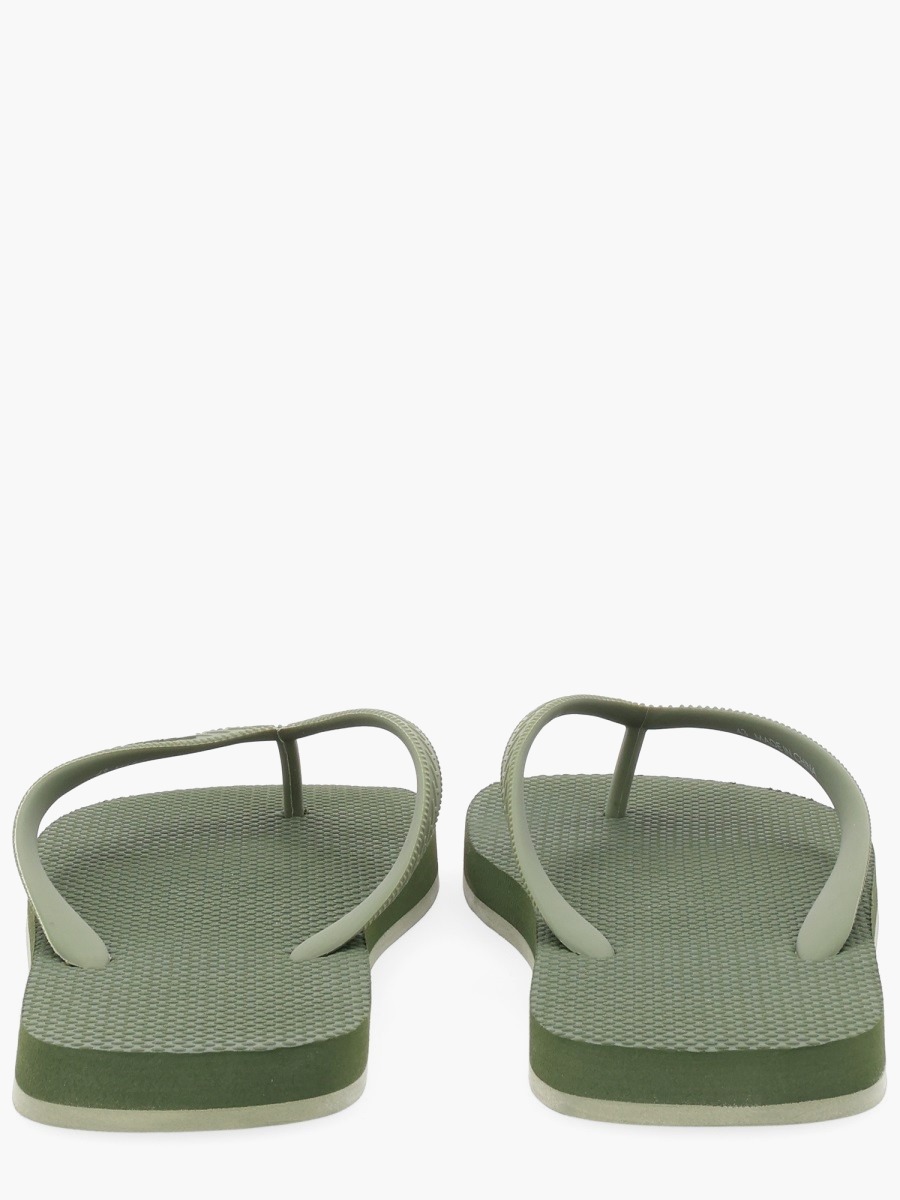 nanito_source_url:https://nokinstyle.com/2343861/flip-plop-slipper-with-logo.jpg